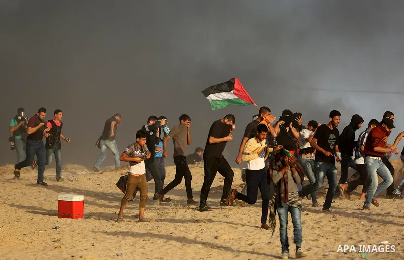 Palestinian protesters gather during clashes with Israeli forces in a demonstration against the Israeli blockade on Gaza Strip, along the Gaza sea barrier on the maritime border with Israel near Kibbutz Zikim, north of B...