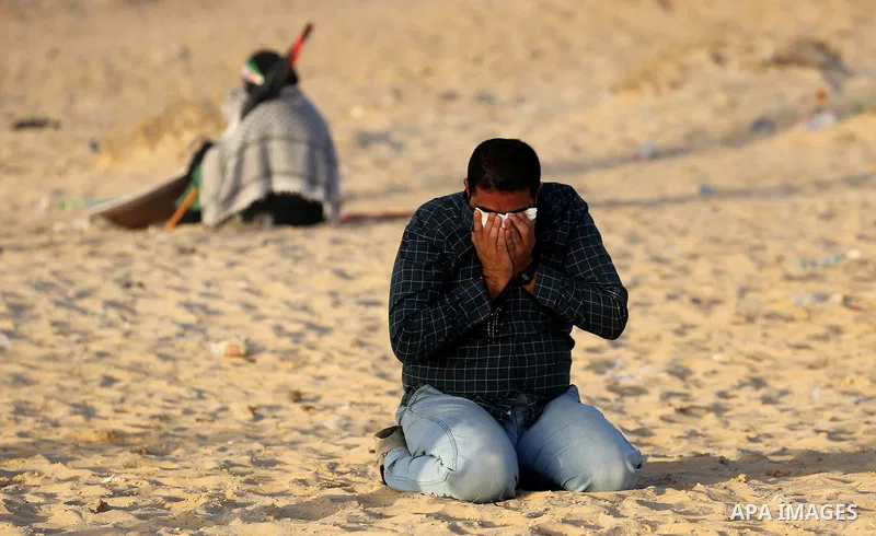 Palestinian protesters gather during clashes with Israeli forces in a demonstration against the Israeli blockade on Gaza Strip, along the Gaza sea barrier on the maritime border with Israel near Kibbutz Zikim, north of B...