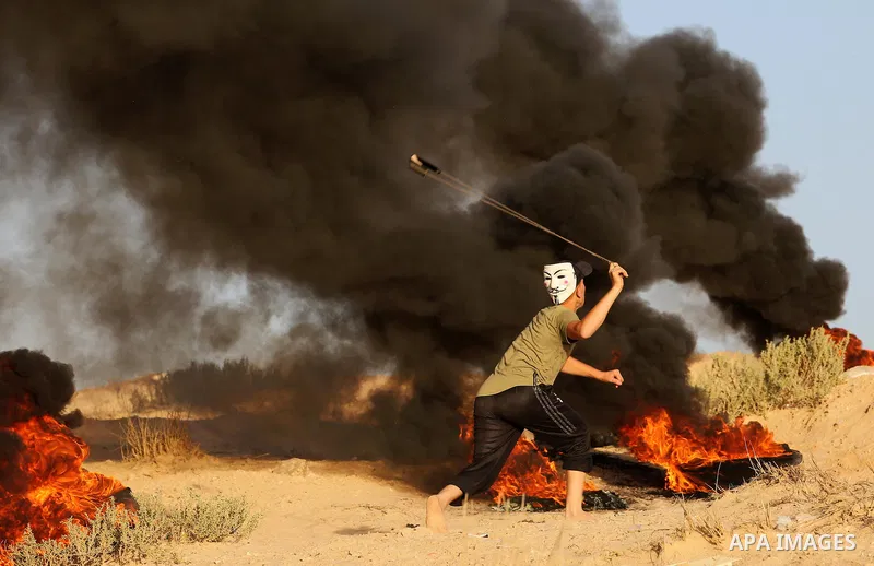 Palestinian protesters gather during clashes with Israeli forces in a demonstration against the Israeli blockade on Gaza Strip, along the Gaza sea barrier on the maritime border with Israel near Kibbutz Zikim, north of B...