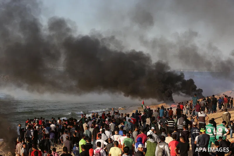 Palestinian protesters gather during clashes with Israeli forces in a demonstration against the Israeli blockade on Gaza Strip, along the Gaza sea barrier on the maritime border with Israel near Kibbutz Zikim, north of B...