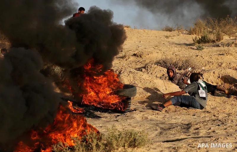 Palestinian protesters gather during clashes with Israeli forces in a demonstration against the Israeli blockade on Gaza Strip, along the Gaza sea barrier on the maritime border with Israel near Kibbutz Zikim, north of B...