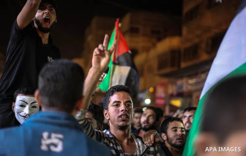 Palestinians take part in a demonstration against the killing of Palestinian teenagers, by an Israeli air strike the day before, in Jabalia in the northern of Gaza Strip on October 29, 2018. Photo by Ramez Habboub