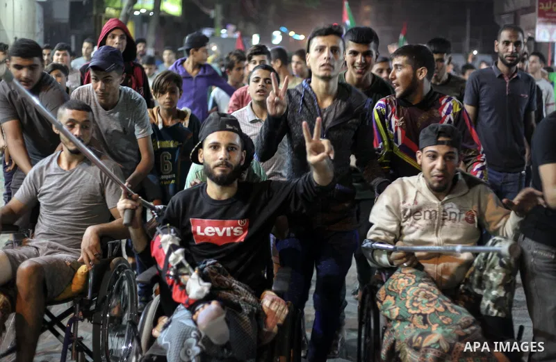 Palestinians take part in a demonstration against the killing of Palestinian teenagers, by an Israeli air strike the day before, in Jabalia in the northern of Gaza Strip on October 29, 2018. Photo by Ramez Habboub