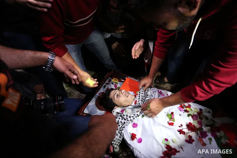 Relatives of Palestinian Mohammed abu Abada, 27, who was shot dead by Israeli forces during a demonstration against the Israeli blockade on Gaza Strip, along the Gaza sea barrier on the maritime border with Israel near K...
