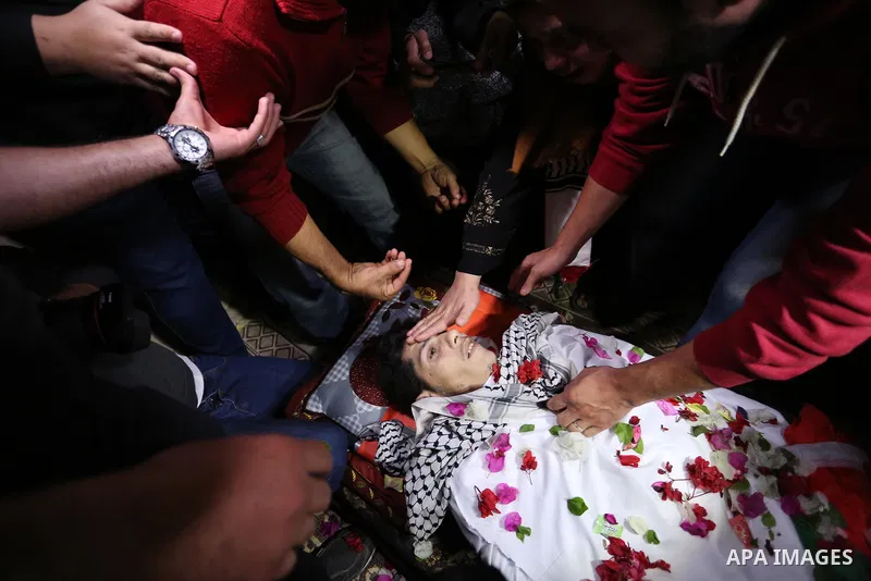Relatives of Palestinian Mohammed abu Abada, 27, who was shot dead by Israeli forces during a demonstration against the Israeli blockade on Gaza Strip, along the Gaza sea barrier on the maritime border with Israel near K...
