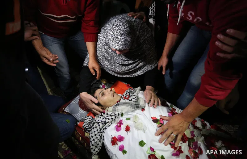 Relatives of Palestinian Mohammed abu Abada, 27, who was shot dead by Israeli forces during a demonstration against the Israeli blockade on Gaza Strip, along the Gaza sea barrier on the maritime border with Israel near K...