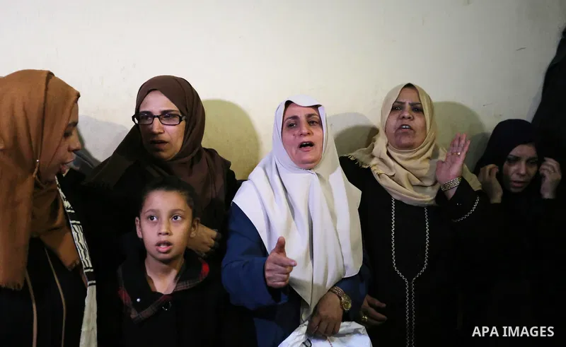 Relatives of Palestinian Mohammed abu Abada, 27, who was shot dead by Israeli forces during a demonstration against the Israeli blockade on Gaza Strip, along the Gaza sea barrier on the maritime border with Israel near K...