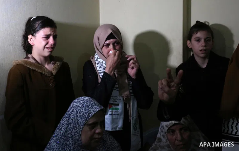 Relatives of Palestinian Mohammed abu Abada, 27, who was shot dead by Israeli forces during a demonstration against the Israeli blockade on Gaza Strip, along the Gaza sea barrier on the maritime border with Israel near K...
