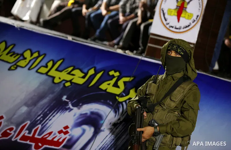 Palestinian Islamic Jihad militants take part during a memorial service for Islamic Jihad militants who were killed in an Israeli operation to blow up a tunnel last year, at the Bureij refugee camp, in central Gaza Strip...