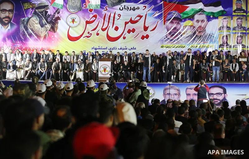 Palestinian supporters of Islamic Jihad movement attends a memorial service for Islamic Jihad militants who were killed in an Israeli operation to blow up a tunnel last year, at the Bureij refugee camp, in central Gaza S...