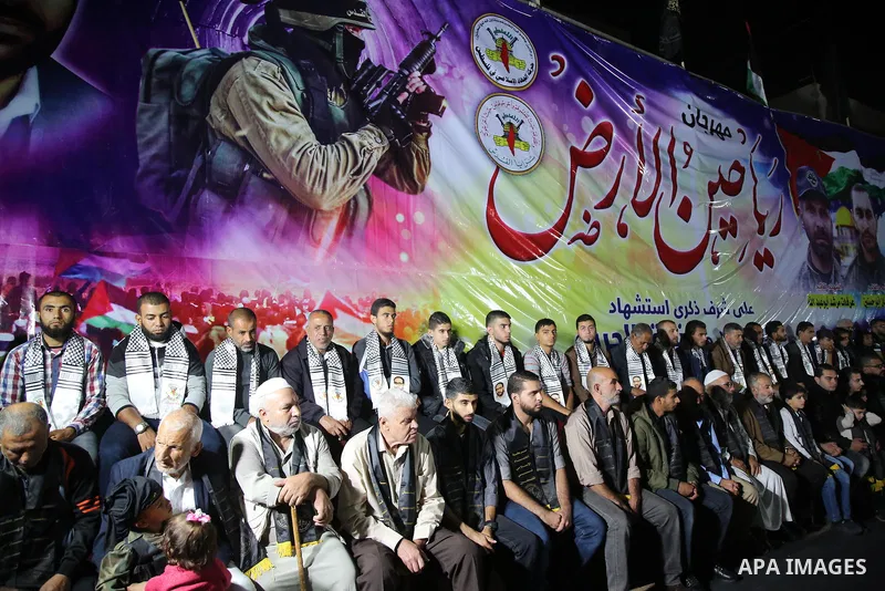 Palestinian supporters of Islamic Jihad movement attends a memorial service for Islamic Jihad militants who were killed in an Israeli operation to blow up a tunnel last year, at the Bureij refugee camp, in central Gaza S...