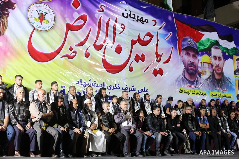 Palestinian supporters of Islamic Jihad movement attends a memorial service for Islamic Jihad militants who were killed in an Israeli operation to blow up a tunnel last year, at the Bureij refugee camp, in central Gaza S...