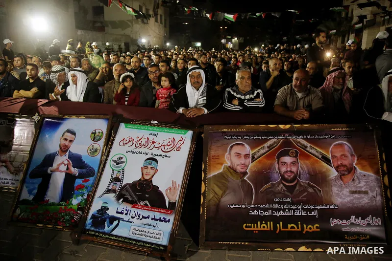 Palestinian supporters of Islamic Jihad movement attends a memorial service for Islamic Jihad militants who were killed in an Israeli operation to blow up a tunnel last year, at the Bureij refugee camp, in central Gaza S...