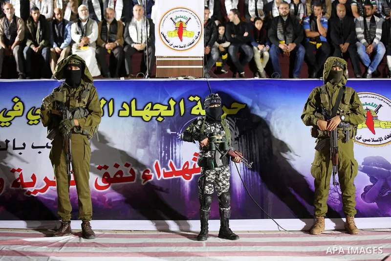 Palestinian Islamic Jihad militants take part during a memorial service for Islamic Jihad militants who were killed in an Israeli operation to blow up a tunnel last year, at the Bureij refugee camp, in central Gaza Strip...
