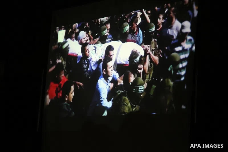 Palestinian supporters of Islamic Jihad movement attends a memorial service for Islamic Jihad militants who were killed in an Israeli operation to blow up a tunnel last year, at the Bureij refugee camp, in central Gaza S...
