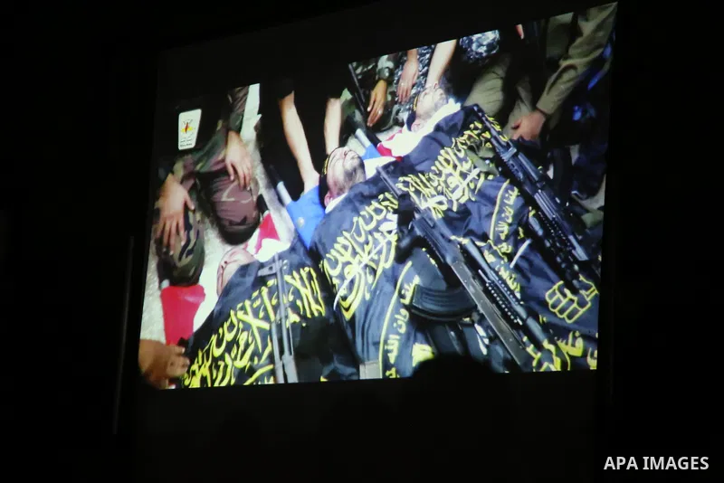 Palestinian supporters of Islamic Jihad movement attends a memorial service for Islamic Jihad militants who were killed in an Israeli operation to blow up a tunnel last year, at the Bureij refugee camp, in central Gaza S...
