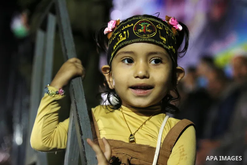 Palestinian supporters of Islamic Jihad movement attends a memorial service for Islamic Jihad militants who were killed in an Israeli operation to blow up a tunnel last year, at the Bureij refugee camp, in central Gaza S...