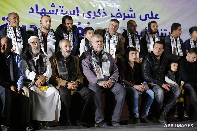 Palestinian supporters of Islamic Jihad movement attends a memorial service for Islamic Jihad militants who were killed in an Israeli operation to blow up a tunnel last year, at the Bureij refugee camp, in central Gaza S...