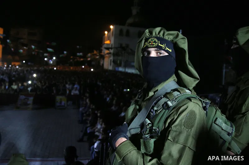 Palestinian Islamic Jihad militants take part during a memorial service for Islamic Jihad militants who were killed in an Israeli operation to blow up a tunnel last year, at the Bureij refugee camp, in central Gaza Strip...