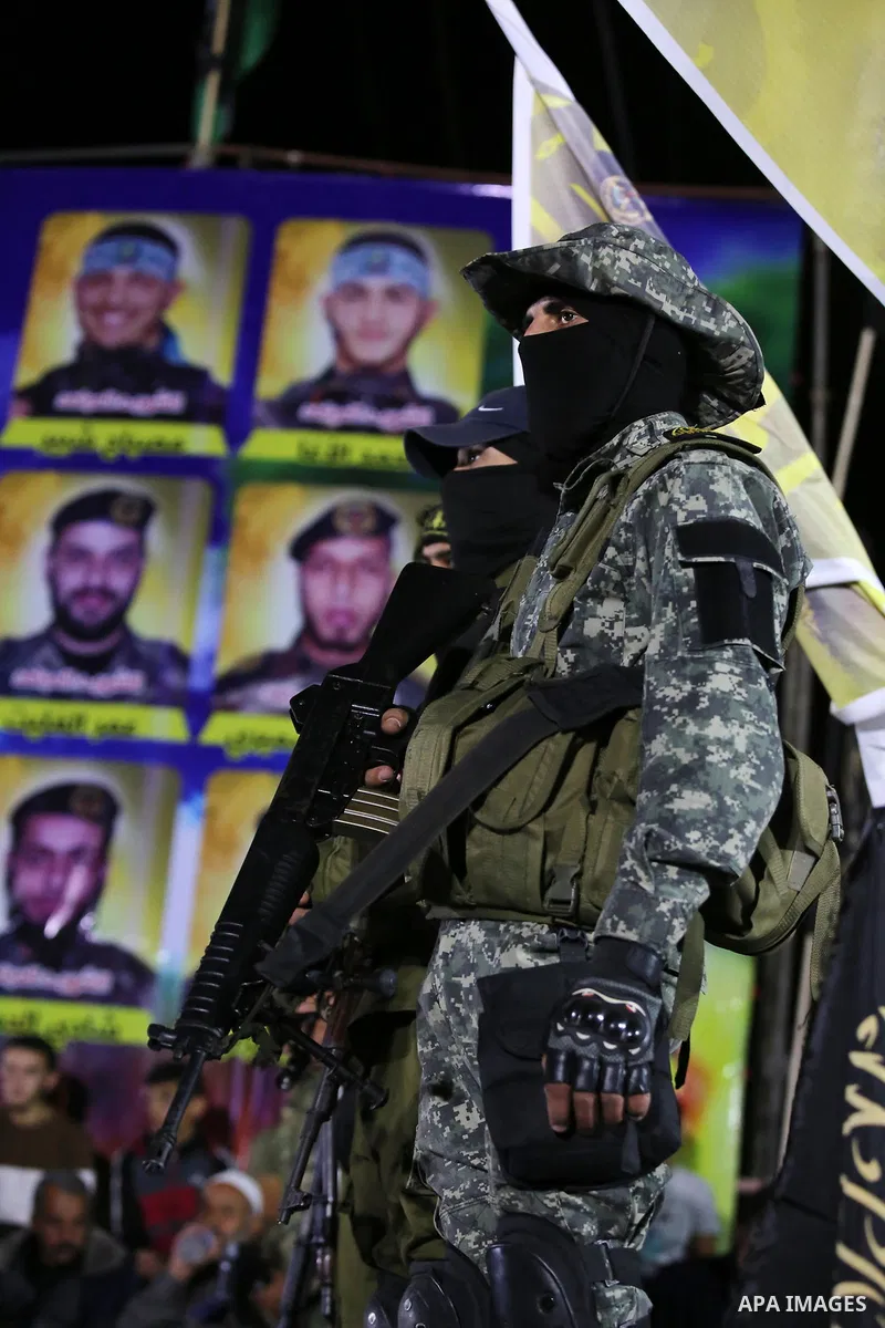 Palestinian Islamic Jihad militants take part during a memorial service for Islamic Jihad militants who were killed in an Israeli operation to blow up a tunnel last year, at the Bureij refugee camp, in central Gaza Strip...