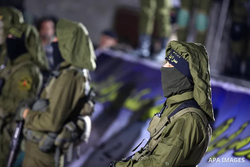 Palestinian Islamic Jihad militants take part during a memorial service for Islamic Jihad militants who were killed in an Israeli operation to blow up a tunnel last year, at the Bureij refugee camp, in central Gaza Strip...