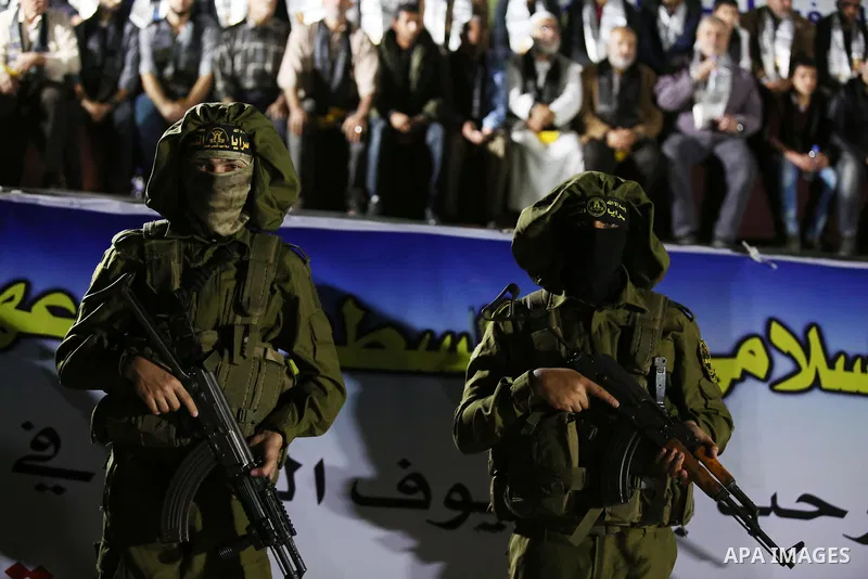 Palestinian Islamic Jihad militants take part during a memorial service for Islamic Jihad militants who were killed in an Israeli operation to blow up a tunnel last year, at the Bureij refugee camp, in central Gaza Strip...