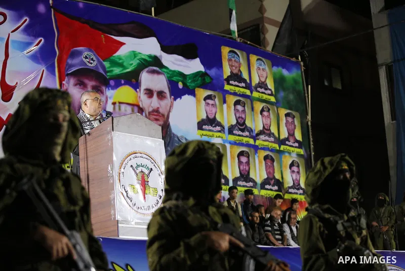 Senior Hamas leader Ismail Radwan, speaks during a memorial service for Islamic Jihad militants who were killed in an Israeli operation to blow up a tunnel last year, at the Bureij refugee camp, in central Gaza Strip, on...