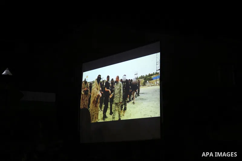 Palestinian supporters of Islamic Jihad movement attends a memorial service for Islamic Jihad militants who were killed in an Israeli operation to blow up a tunnel last year, at the Bureij refugee camp, in central Gaza S...
