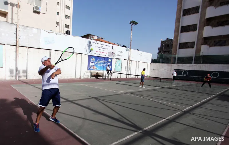 Palestinian tennis's players participate during doubles match at a local tennis championship, in Gaza City on October 31, 2018. Photo by Mahmoud Ajjour