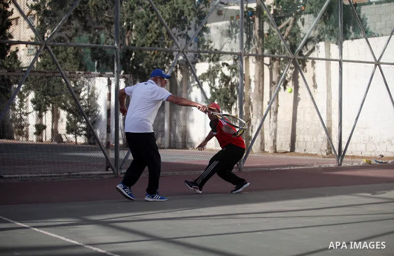 Palestinian tennis's players participate during doubles match at a local tennis championship, in Gaza City on October 31, 2018. Photo by Mahmoud Ajjour