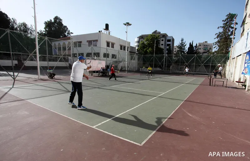Palestinian tennis's players participate during doubles match at a local tennis championship, in Gaza City on October 31, 2018. Photo by Mahmoud Ajjour