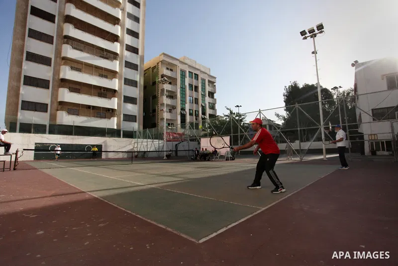 Palestinian tennis's players participate during doubles match at a local tennis championship, in Gaza City on October 31, 2018. Photo by Mahmoud Ajjour
