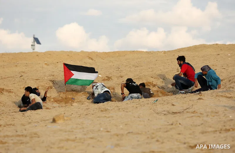 Palestinian protesters gather during clashes with Israeli forces in a demonstration against the Israeli blockade on Gaza Strip, along the Gaza sea barrier on the maritime border with Israel near Kibbutz Zikim, north of B...