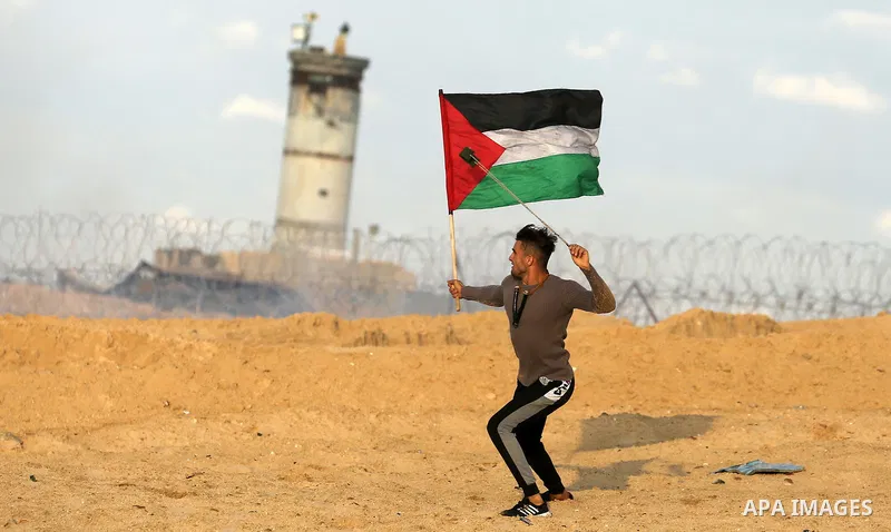 Palestinian protesters gather during clashes with Israeli forces in a demonstration against the Israeli blockade on Gaza Strip, along the Gaza sea barrier on the maritime border with Israel near Kibbutz Zikim, north of B...