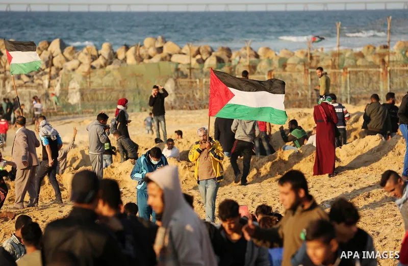 Palestinian protesters gather during clashes with Israeli forces in a demonstration against the Israeli blockade on Gaza Strip, along the Gaza sea barrier on the maritime border with Israel near Kibbutz Zikim, north of B...