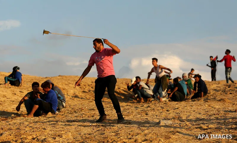 Palestinian protesters gather during clashes with Israeli forces in a demonstration against the Israeli blockade on Gaza Strip, along the Gaza sea barrier on the maritime border with Israel near Kibbutz Zikim, north of B...