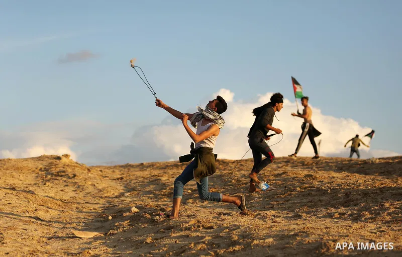 Palestinian protesters gather during clashes with Israeli forces in a demonstration against the Israeli blockade on Gaza Strip, along the Gaza sea barrier on the maritime border with Israel near Kibbutz Zikim, north of B...