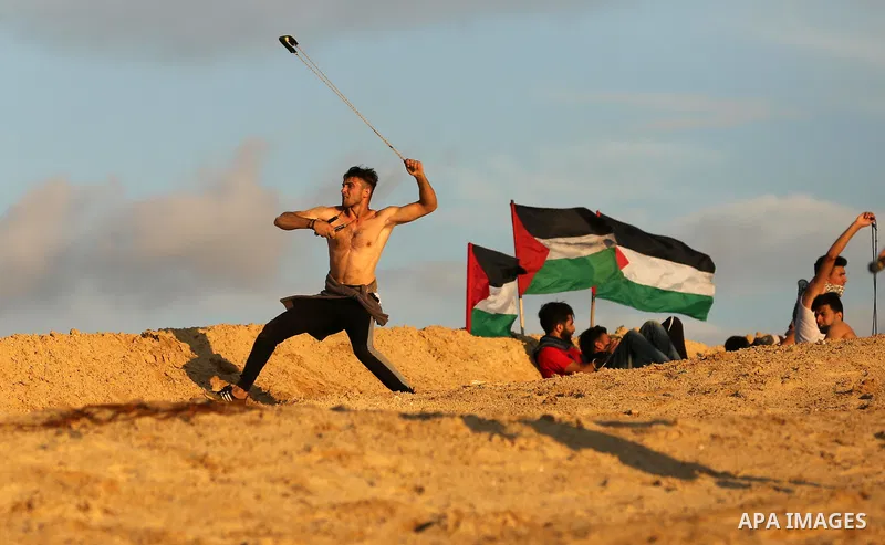 Palestinian protesters gather during clashes with Israeli forces in a demonstration against the Israeli blockade on Gaza Strip, along the Gaza sea barrier on the maritime border with Israel near Kibbutz Zikim, north of B...