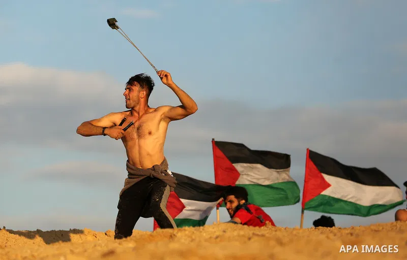 Palestinian protesters gather during clashes with Israeli forces in a demonstration against the Israeli blockade on Gaza Strip, along the Gaza sea barrier on the maritime border with Israel near Kibbutz Zikim, north of B...