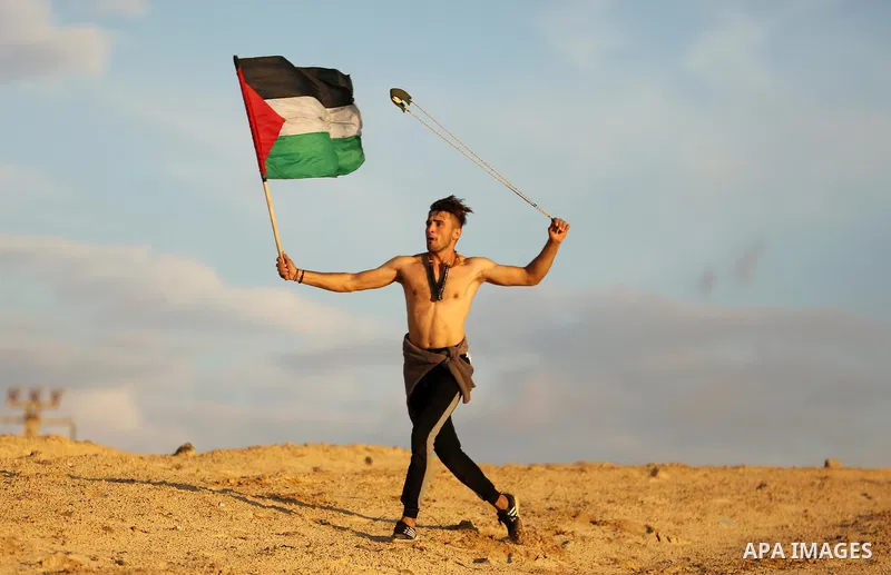 Palestinian protesters gather during clashes with Israeli forces in a demonstration against the Israeli blockade on Gaza Strip, along the Gaza sea barrier on the maritime border with Israel near Kibbutz Zikim, north of B...