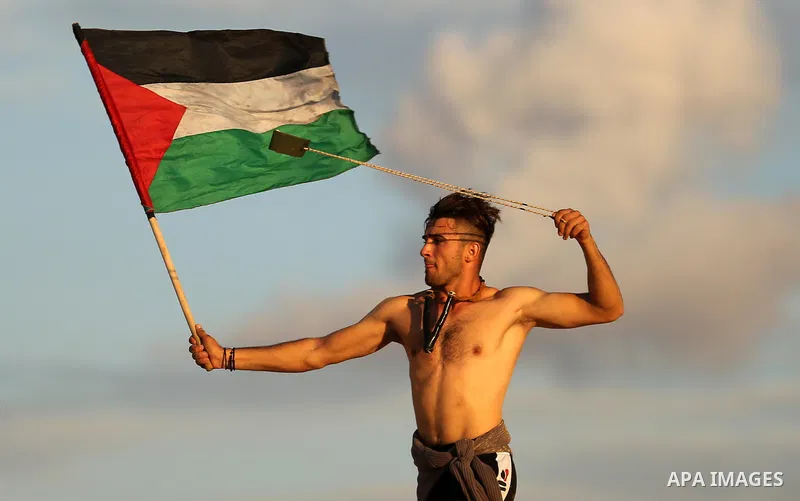Palestinian protesters gather during clashes with Israeli forces in a demonstration against the Israeli blockade on Gaza Strip, along the Gaza sea barrier on the maritime border with Israel near Kibbutz Zikim, north of B...