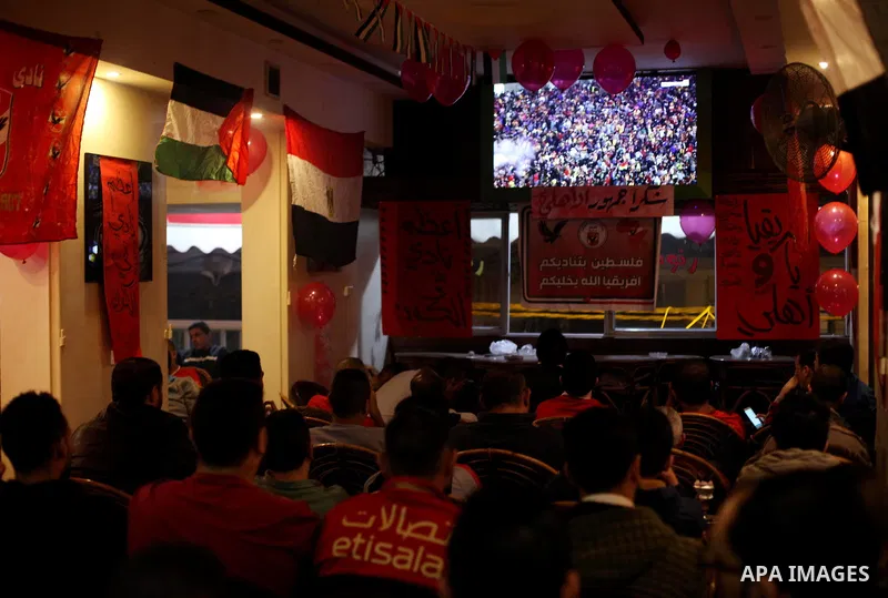 Palestinian fans watch the CAF Champions League second leg final football match between Egypt's Al-Ahly and Tunisia's ES Tunis which held on the Olympic stadium in Rades on a screen, in Gaza City on November 9, 2018. Pho...