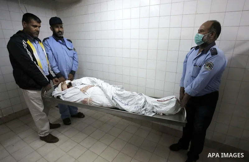 The body of Palestinian Mohammed Rami Qahman, 28, who was shot dead by Israeli forces at the Israel-Gaza border, at the morgue of the European Hospital in Khan Yunis in the southern Gaza Strip on November 9, 2018 Photo b...