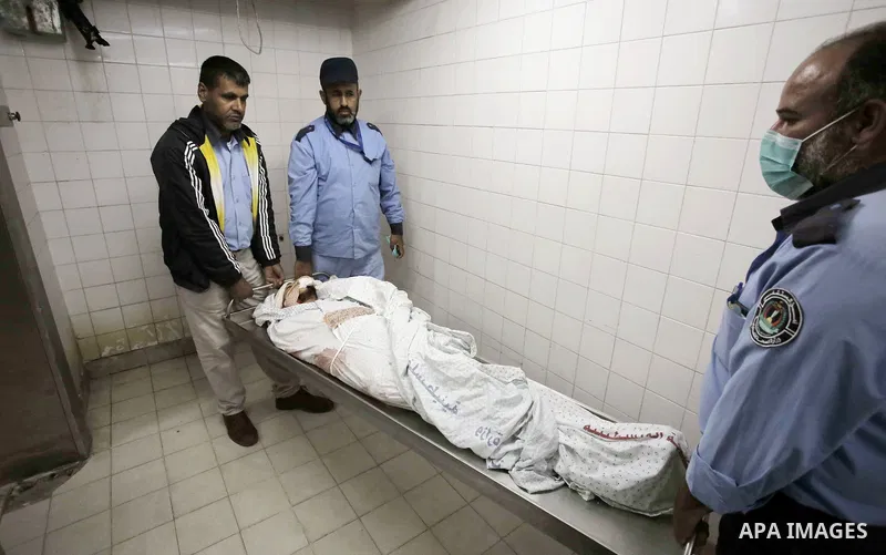 The body of Palestinian Mohammed Rami Qahman, 28, who was shot dead by Israeli forces at the Israel-Gaza border, at the morgue of the European Hospital in Khan Yunis in the southern Gaza Strip on November 9, 2018 Photo b...