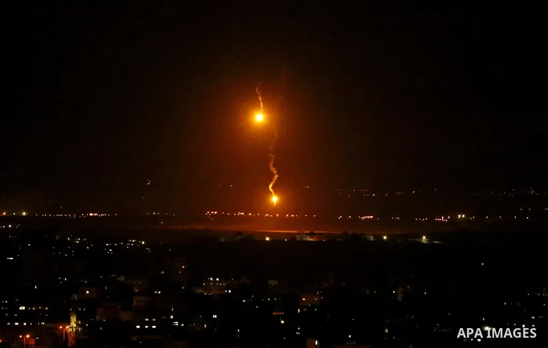 Flares fired by Israeli forces are seen over the Israel-Gaza border, after Israeli air targeting Gaza City on November 12, 2018. Israel's military said it was carrying out air strikes "throughout the Gaza Strip" after a...