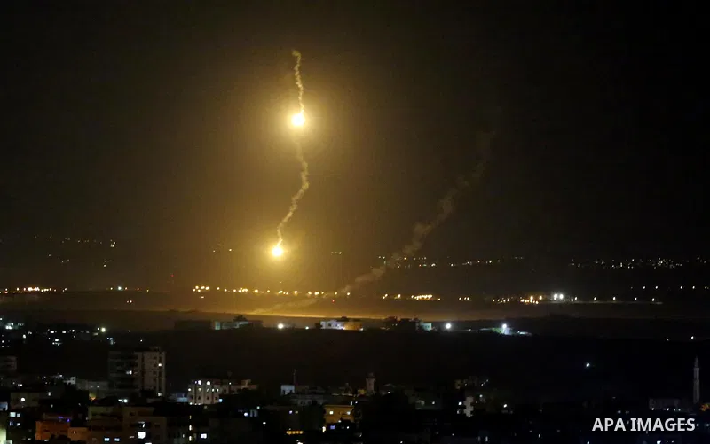 Flares fired by Israeli forces are seen over the Israel-Gaza border, after Israeli air targeting Gaza City on November 12, 2018. Israel's military said it was carrying out air strikes "throughout the Gaza Strip" after a...