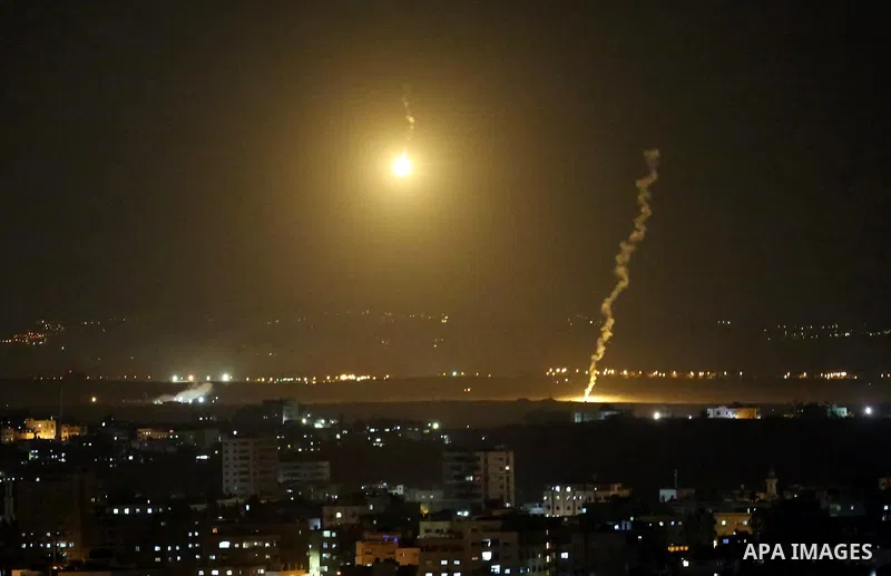 Flares fired by Israeli forces are seen over the Israel-Gaza border, after Israeli air targeting Gaza City on November 12, 2018. Israel's military said it was carrying out air strikes "throughout the Gaza Strip" after a...