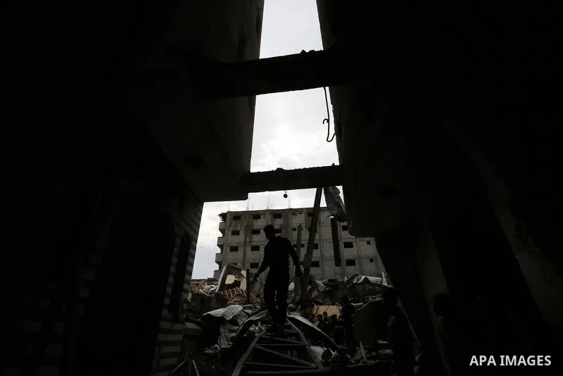 Palestinians inspect the rubble of the television station al-Aqsa TV destroyed by Israeli air strikes in Gaza City on November 15, 2018. Photo by Ashraf Amra