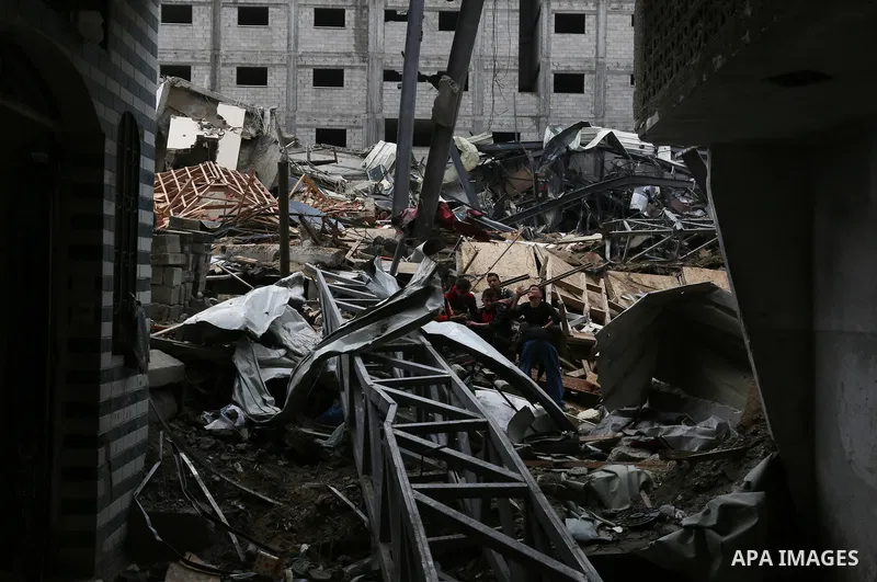 Palestinians inspect the rubble of the television station al-Aqsa TV destroyed by Israeli air strikes in Gaza City on November 15, 2018. Photo by Ashraf Amra