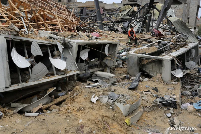 Palestinians inspect the rubble of the television station al-Aqsa TV destroyed by Israeli air strikes in Gaza City on November 15, 2018. Photo by Ashraf Amra